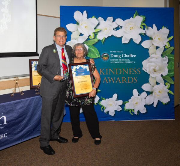 Orange County Board of Supervisors Chairman Doug Chaffee awards Sandy Castillo at the Fourth District Kindness Awards ceremony in Fullerton, Calif., on Nov. 13, 2022. (Courtesy of the Office of Chairman Doug Chaffee)