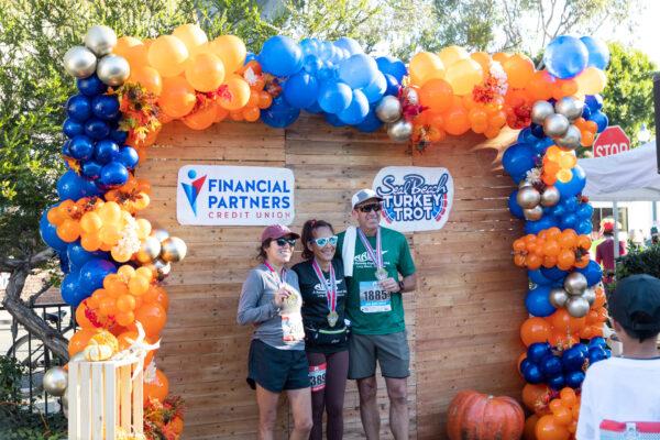 Participants run the annual Turkey Trot in Seal Beach, Calif., on Nov. 19, 2022. (Julianne Foster/The Epoch Times)
