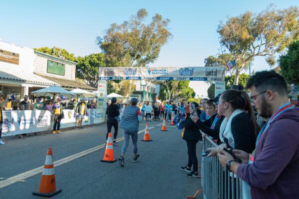 Participants run the annual Turkey Trot in Seal Beach, Calif., on Nov. 19, 2022. (Julianne Foster/The Epoch Times)