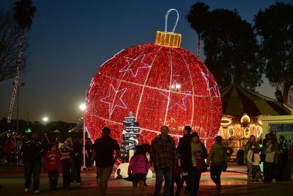 Evening visitors stroll the grounds at Winterfest in Costa Mesa, Calif., on Dec. 19, 2016. (Frederic J. Brown/AFP via Getty Images)