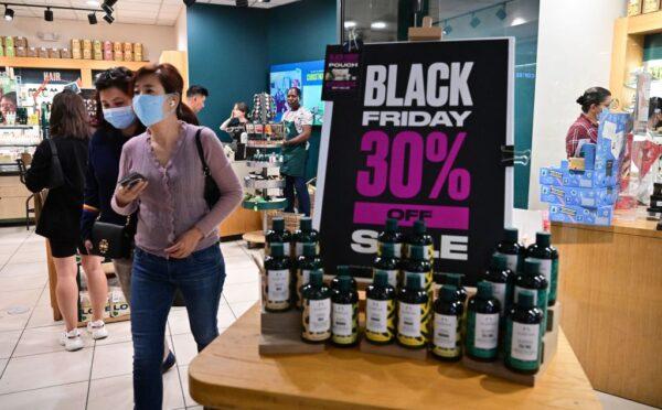 People shop during Black Friday in Santa Anita within the city of Arcadia, Calif., on Nov. 25, 2022. - Inflation hovers over US shoppers this year as many hit the stores for the traditional day-after-Thanksgiving shopping sales. (Frederic J. Brown/AFP via Getty Images)