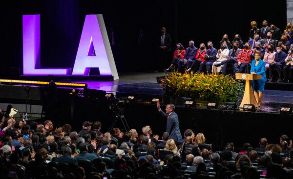 Former Los Angeles Mayor Eric Garcetti waves to the crowd of the mayoral inauguration ceremony of Karen Bass at the Microsoft Theatre in Los Angeles on Dec. 11, 2022. (John Fredricks/The Epoch Times)