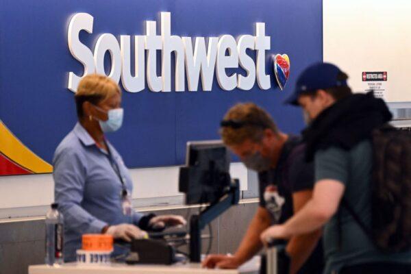 Passengers check-in for a Southwest Airlines Co. flight inside Terminal 1 at Los Angeles International Airport (LAX) in Los Angeles, on Aug. 10, 2022. (Patrick T. Fallon/AFP via Getty Images)