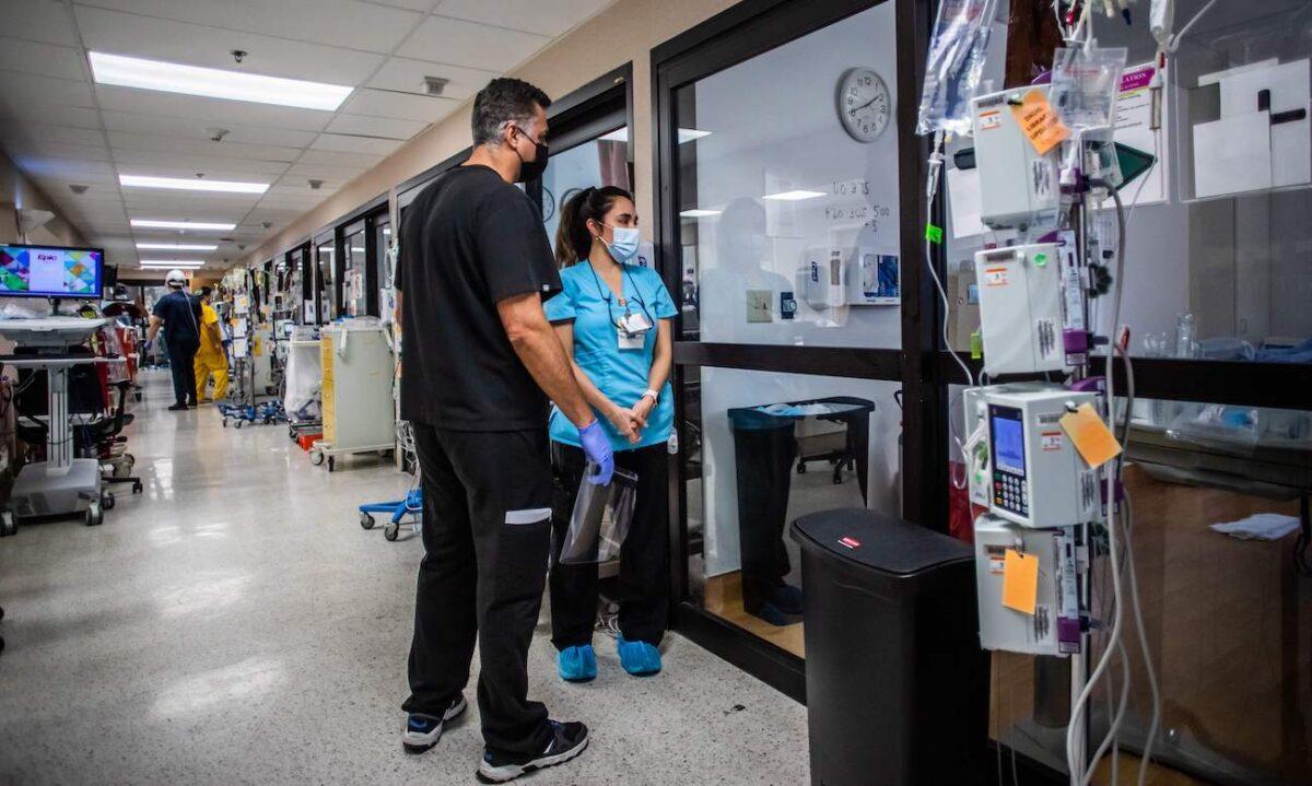 A doctor and nurse observe a patient at Providence Cedars-Sinai Tarzana Medical Center in Tarzana, Calif., on Jan. 3, 2021. (Apu Gomes/AFP via Getty Images)