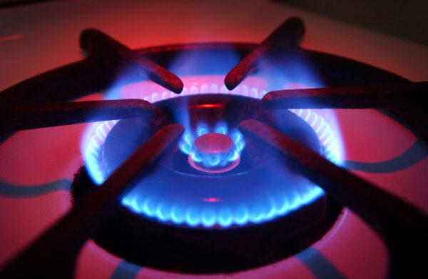 Blue flames rise from the burner of a natural gas stove in Orange, Calif., June 11, 2003. (David McNew/Getty Images)