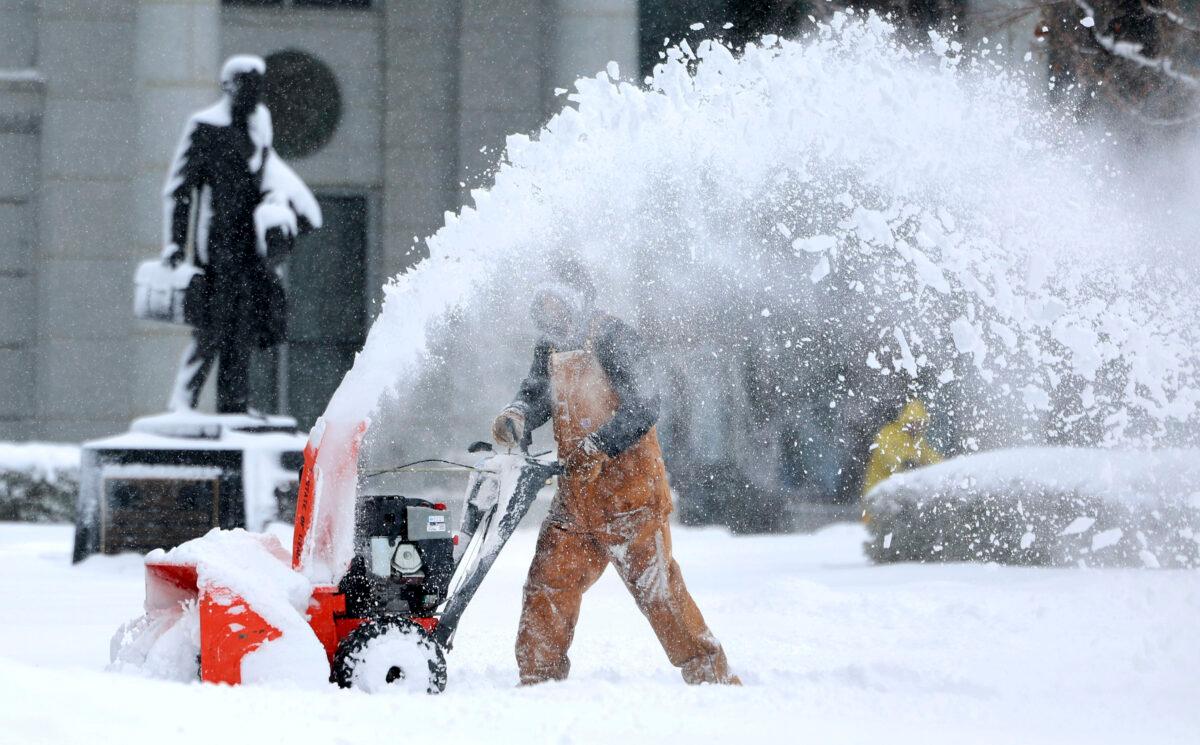Capitol groundskeeper Mike Nielson clears the walkways at the Capitol in Salt Lake City, Utah, on Feb. 22, 2023. (Laura Seitz/The Deseret News via AP)