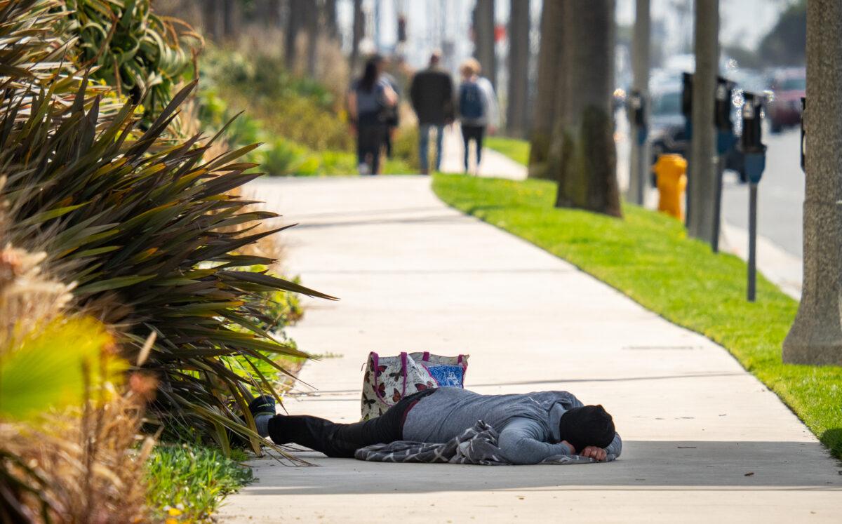 A homeless man in Huntington Beach, Calif., on March 17, 2023. (John Fredricks/The Epoch Times)