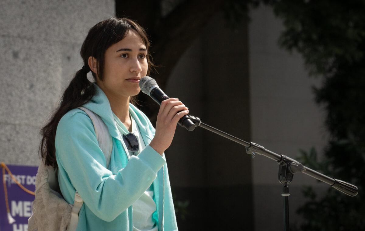 Chloe Cole shares speaks about her detransition story in front of the California State Capitol building in Sacramento, Calif., on March 10, 2023. (John Fredricks/The Epoch Times)