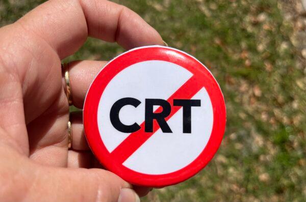 Parents concerned about critical race theory (CRT) took home buttons like this from a school board activist training put on by the The Leadership Institute in Sarasota, Fla., on Jan. 19, 2022. (Nanette Holt/The Epoch Times)
