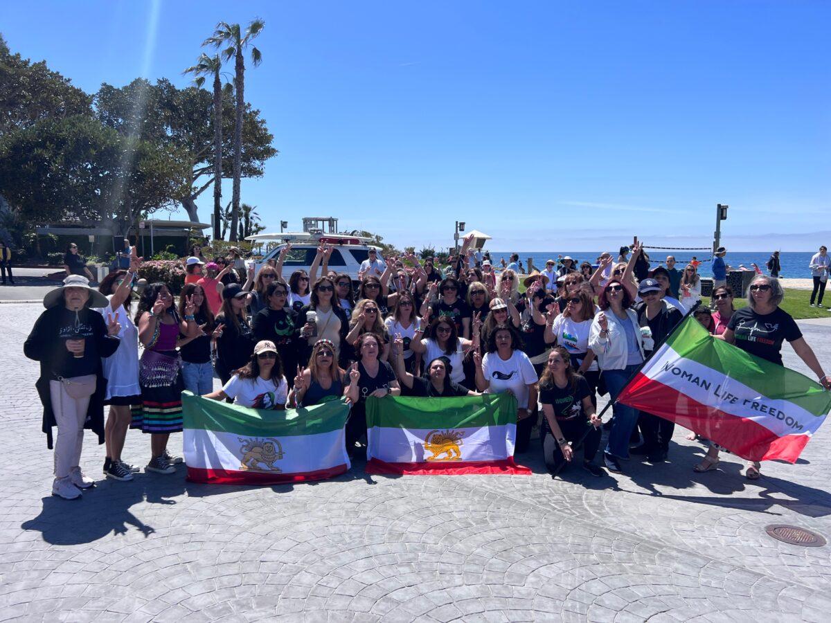 Iranian American women participate in a flash mob to raise awareness of human rights violations in Iran in Laguna Beach, California on April 8, 2023. (Rudy Blalock/The Epoch Times)