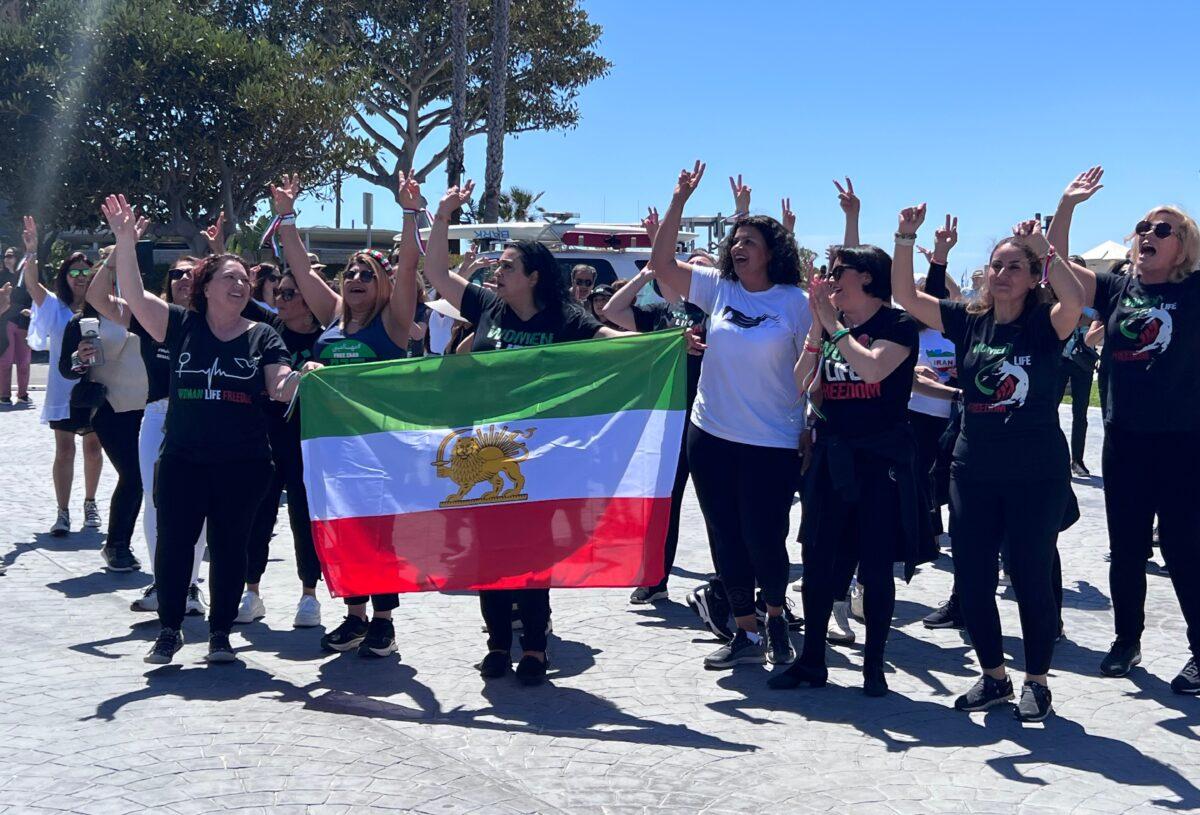 Iranian American women participate in a flash mob to raise awareness of human rights violations in Iran in Laguna Beach, California on April 8, 2023. (Rudy Blalock/The Epoch Times)