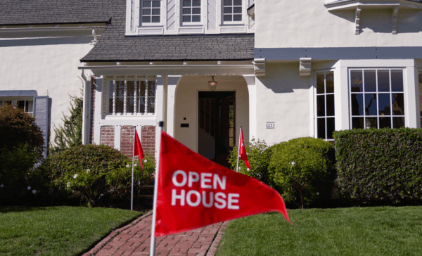 An 'open house' flag is displayed outside a single family home in Los Angeles on Sept. 22, 2022. (Allison Dinner/Getty Images)