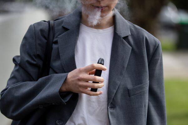 A person vapes in Melbourne, Australia, on May 3, 2023. (AAP Image/Diego Fedele)