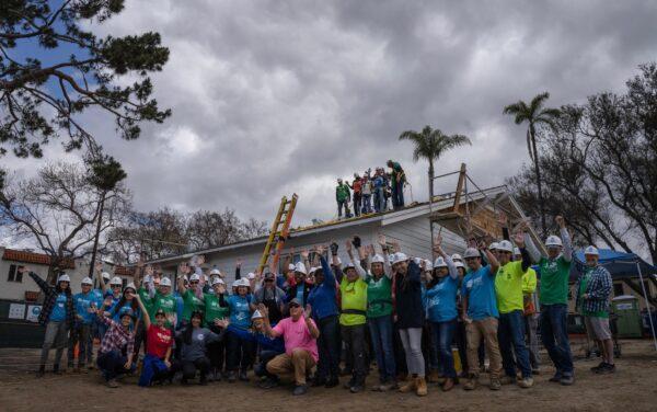Habitat for Humanity members work on finishing two housing units for working-class families in Santa Ana, Calif., on May 5, 2023. (John Fredricks/The Epoch Times)