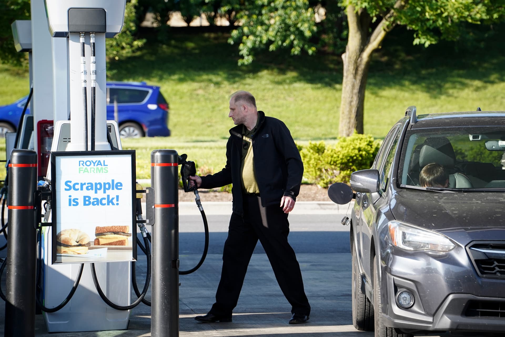 A man uses a gas station in Columbia, Md., on May 17, 2023. (Madalina Vasiliu/The Epoch Times)