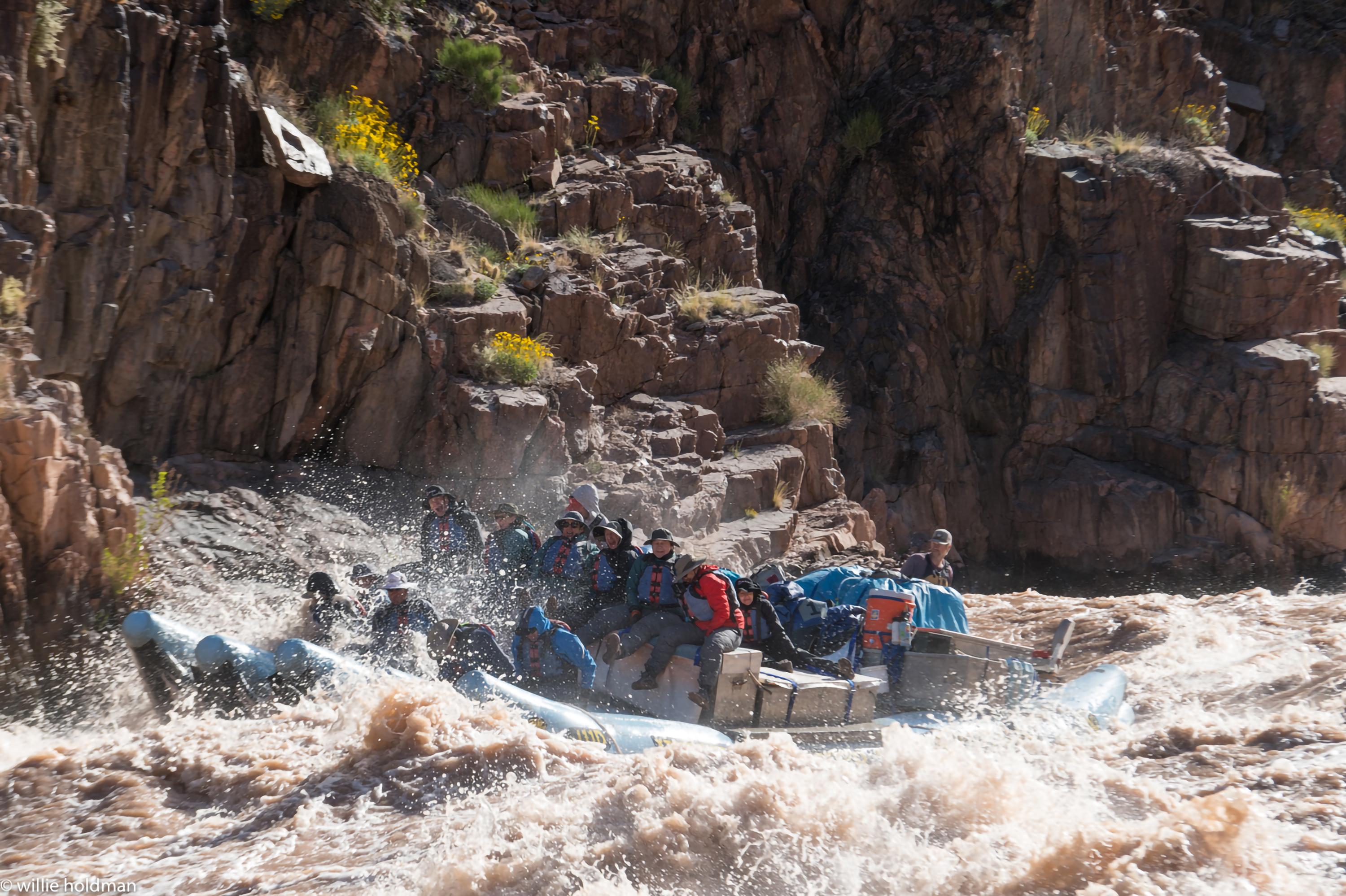 Boatman Joe Clark skillfully steers our raft through Granite Rapid. (Willie Holdman)