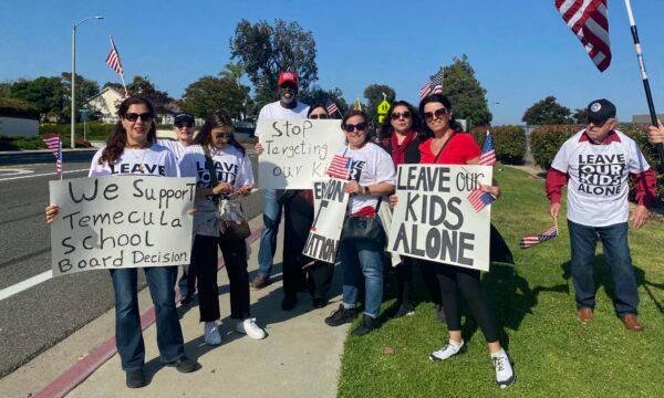 Parents in support of the Temecula Valley Unified school board's decision to terminate the district’s superintendent amid controversy surrounding critical race theory and other school curriculum attend a board meeting in Temecula, Calif., on June 13, 2023. (Micaela Ricaforte/The Epoch Times)