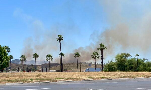 A fire erupts in the hills of Menifee, Calif., on June 20, 2023. (Brad Jones/The Epoch Times)