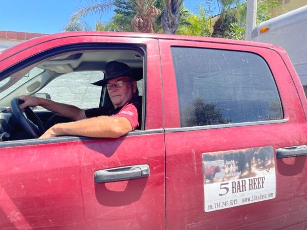 Rancher and 5 Bar Beef owner Frank Fitzpatrick in his truck after delivering cows for slaughter in Cypress, Calif., on July 27, 2023. (Carol Cassis/The Epoch Times)