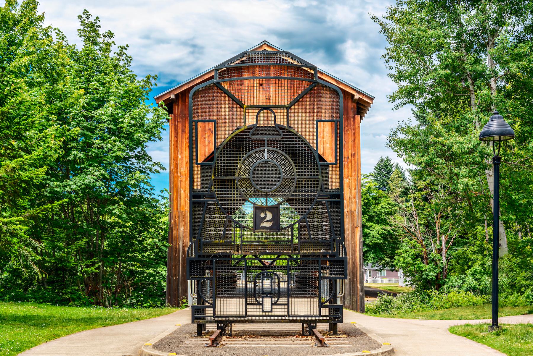 A wrought iron steam engine in front of Chambers Bridge in Cottage Grove, Ore. (Maria Coulson)