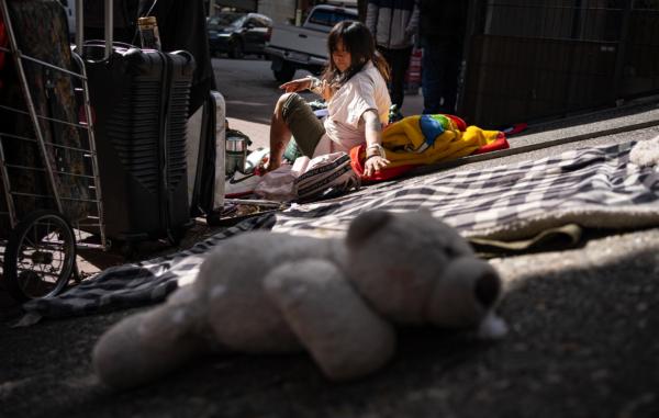 A homeless woman and her belongings in San Francisco on Feb. 23, 2023. (John Fredricks/The Epoch Times)