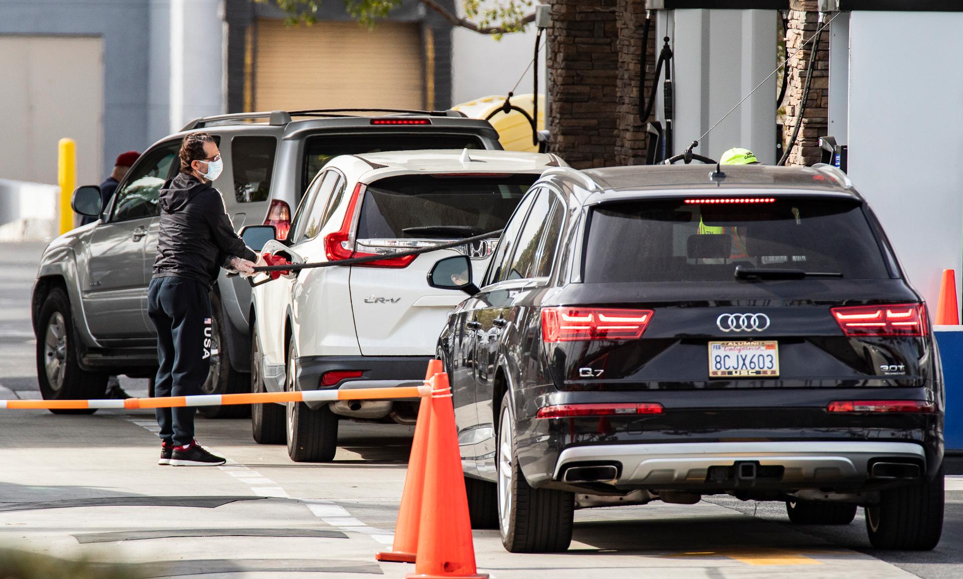 People wait in lines for gasoline at Costco Wholesale in Tustin, Calif., on Jan. 12, 2022. (John Fredricks/The Epoch Times)