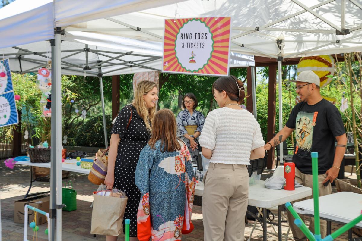 Guests at the Balboa Park Japanese Friendhsip Garden play games and activities for the annual Tanabata Festival in San Diego, Calif., on July 7, 2023. (Julianne Foster/The Epoch Times)