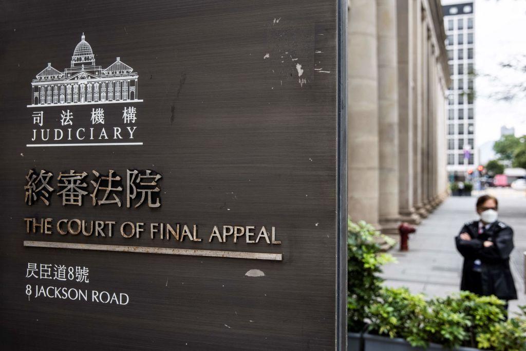 A security guard stands outside the Court of Final Appeal in Hong Kong on March 31, 2022. (Isaac Lawrence/AFP via Getty Images)