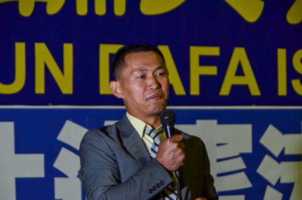 Jie Lijian, executive director of the Youth Department of the Chinese Democratic Party, speaks at a candlelight vigil in front of the Chinese Consulate in Los Angeles on July 18, 2023. (Alex Lee/The Epoch Times)