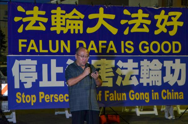 Zheng Cunzhu, vice chairman of the United Headquarters of the China Democratic Party, speaks at a candlelight vigil in front of the Chinese Consulate in Los Angeles on July 18, 2023. (Alex Lee/The Epoch Times)