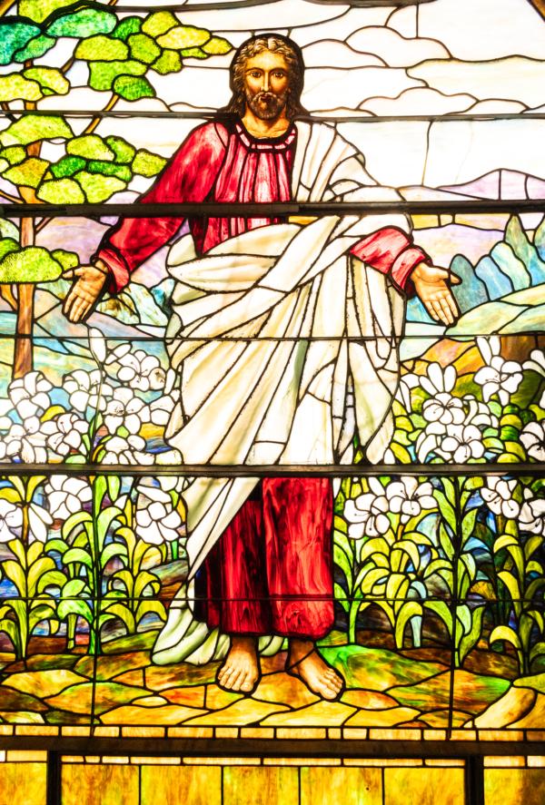 A stained glass window dipicting Jesus Christ sits within Surf City Church in Huntington Beach, Calif., on July 20, 2023. (John Fredricks/The Epoch Times)