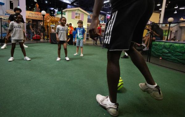 Players of the Orange County Soccer Club teach children soccer maneuvers at the Pretend City Children’s Museum in Irvine, Calif., on July 28, 2023. (John Fredricks/The Epoch Times)