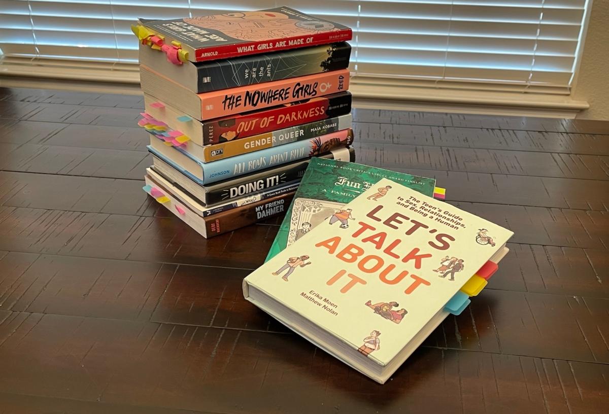 A stack of books containing explicit language and images that have been found in some Texas public school libraries. (Courtesy of Diana Richards)