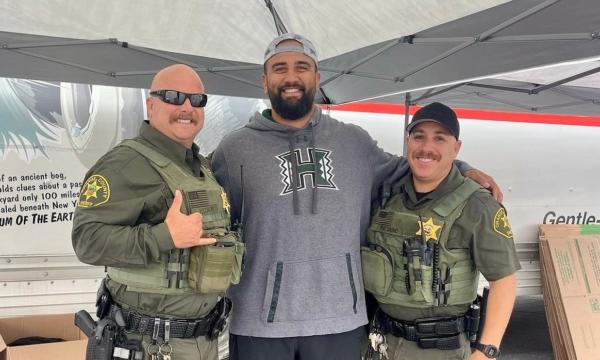 Kody Afusia (C) leads efforts to aid victims of the Maui fires, in Huntington Beach, Calif., on Aug. 14, 2023. (Courtesy of Kody Afusia)