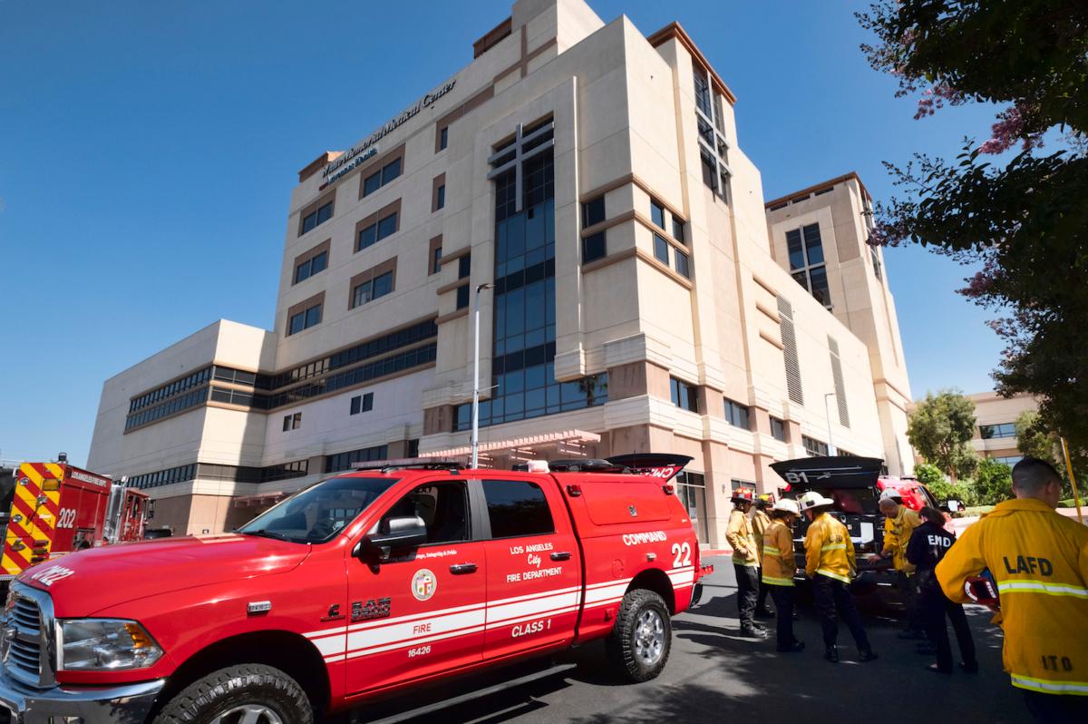 Los Angeles Fire Department personnel gather at the Adventist Health White Memorial Medical Center in L.A., Calif., on Aug. 22, 2023. (Richard Vogel/AP Photo)