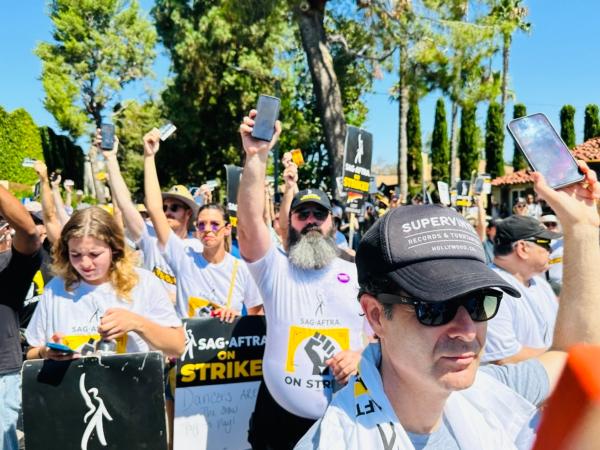 Hollywood writers and actors hold a union rally outside Disney Studios in Burbank, Calif., on Aug. 22, 2023. The “National Day of Solidarity” rally drew an estimated 2,000 people supporting the ongoing strikes against major studios. (Jill McLaughlin/The Epoch Times)