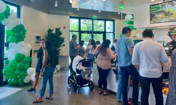The new location of salad restaurant chain Sweetgreen welcomes customers on its grand opening day in Tustin, Calif., on Aug. 22, 2023. (Carol Cassis/The Epoch Times)