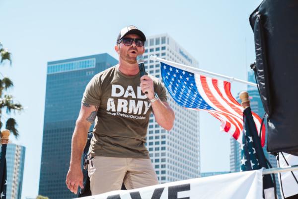 A parent who goes by the pseudonym Ben Richards for fear of retaliation speaks at a rally attended by about 200 parental rights advocates in downtown Los Angeles to protest secret gender transitions in California public schools, on Aug. 22, 2023. (Courtesy of Hasmik Bezirdshyan)