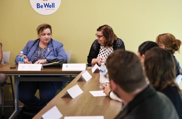 U.S. Department of Labor Assistant Secretary Lisa M. Gomez (L) speaks at a gathering with local leaders and mental health professionals at the Be Well OC offices in Orange, Calif., on Aug. 31, 2023. (John Fredricks/The Epoch Times)