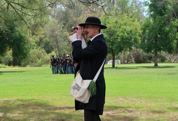 An actor posing as a Harper’s Weekly’s war correspondent documenting a Civil War battle reenactment during the 30th annual Civil War Days event at Huntington Beach Central Park in Huntington Beach, Calif., on Sept. 3, 2023. (Sophie Li/The Epoch Times)