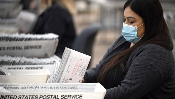 Election workers prepare vote-by-mail ballots at the Los Angeles County Registrar vote-by-mail operation center in City of Industry, California, on November 4, 2022. (Robyn Beck/AFP via Getty Images)