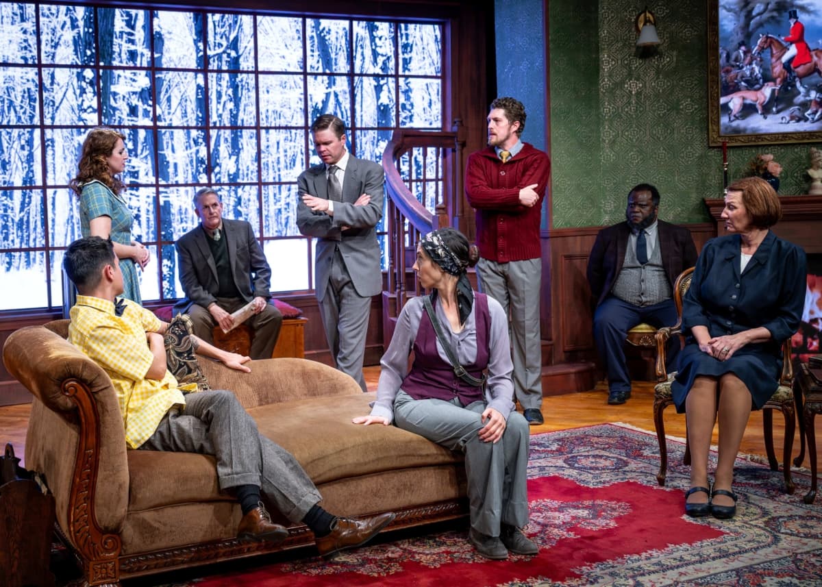 (L–R) Christopher Wren (Jesús Barajas), Mollie Ralston (Mary Margaret McCormack), Maj. Metcalf (William Ryder), Detective Sgt. Trotter (Sean Erik Wesslund), Miss Casewell (Amy Stricker), Giles Ralston (Jack Sharkey), Mr. Paravicinio (Reginald Hemphill), and Mrs. Boyle (Kristie Berger), in the Citadel Theatre 2014 production of "The Mousetrap.“ (North Shore Camera Club)