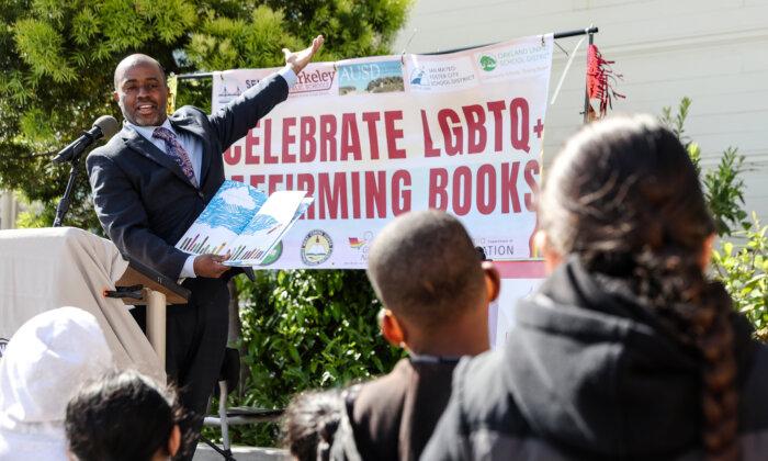 California State Superintendent of Schools Tony Thurmond reads from a book in the LGBTQ+ genre to students at Nystrom Elementary School in Richmond, Calif., on May 17, 2022. Thousands of LGBTQ+ books from Gender Nation were donated to 234 elementary schools in nine California districts. (Justin Sullivan/Getty Images)