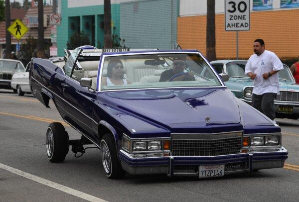 Union members and their families drive lowrider cars through the streets during the annual Labor Day parade and rally in Long Beach, Calif., on Sept. 3, 2018. (Mark Ralston/AFP via Getty Images)