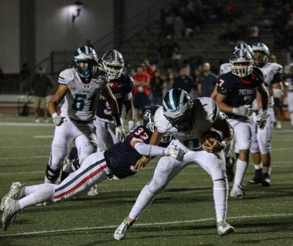 Irvine junior running back Brandon Figueroa breaks a tackle. (Courtesy of Josh Harrell)