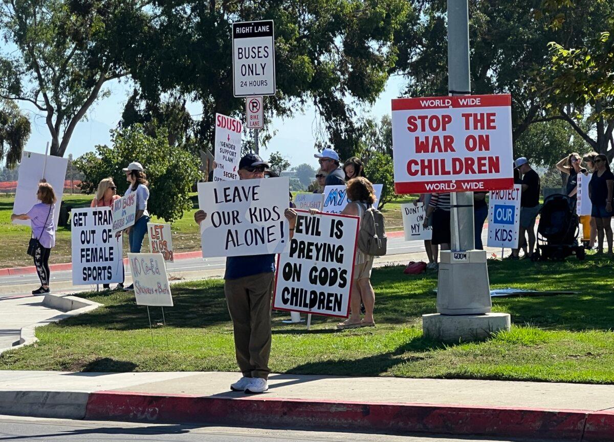 People rally to protest the sexualization of children, secret gender transitions of minors, pornographic books at schools, and other issues in San Diego on Oct. 21, 2023. (Brad Jones/The Epoch Times)