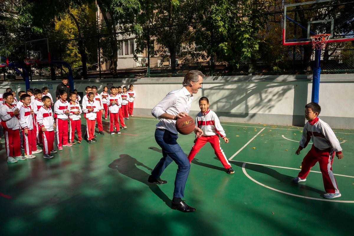 California’s Newsom Plays Hardball in China, Bowls Over Student During Schoolyard Basketball Game