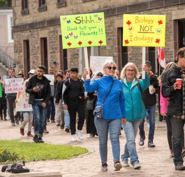 People opposed to the teaching of gender ideology in schools participate in a march on the grounds of the New Brunswick legislature in Fredericton on Sept. 20, 2023. (The Canadian Press/Stephen MacGillivray)