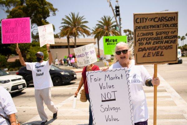 Mobile home residents and their supporters protest outside of Carson City Hall in Carson, Calif., on July 15, 2021. (Patrick T. Fallon/AFP via Getty Images)