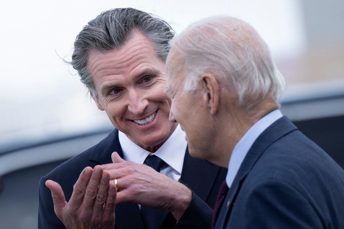 President Joe Biden (R) talks with California Gov. Gavin Newsom after disembarking Air Force One at San Francisco International Airport in San Francisco on Nov. 14, 2023, as he arrives to attend the Asia-Pacific Economic Cooperation (APEC) leaders’ week. (Brendan Smialowski/AFP via Getty Images)